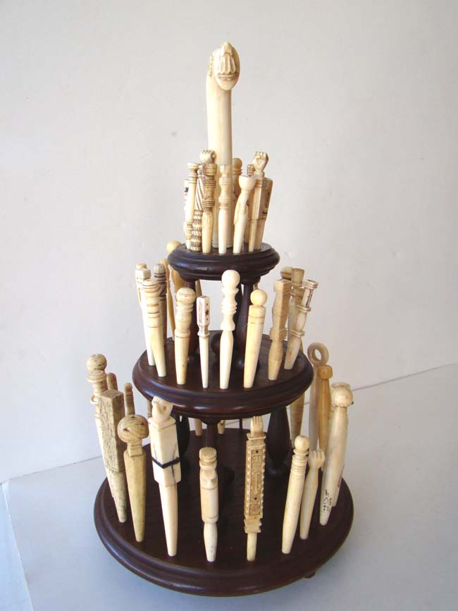 A collection of 46 antique carved whalebone and whale ivory bodkins on a custom made display stand with parasol handle circa 1830-1870. — image 2